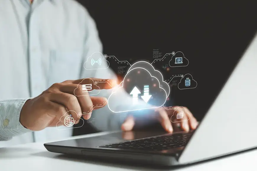 Businessman use laptop computer and hand pointing on virtual cloud computing diagram. Cloud technology. Data storage. Networking and Internet service concept.